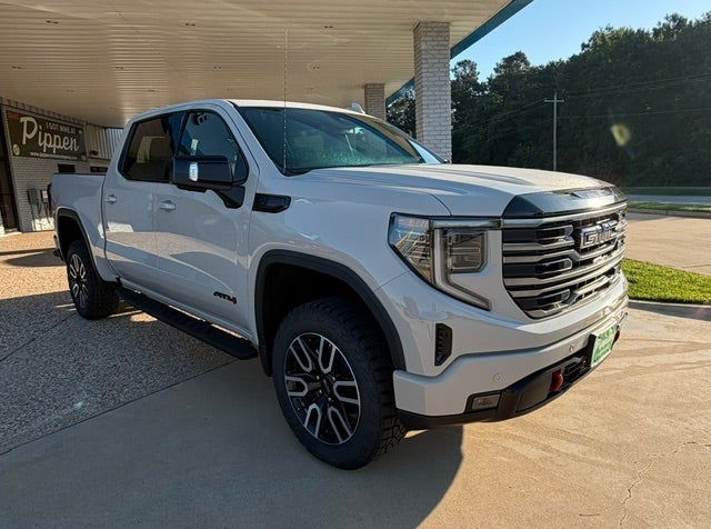 2026 GMC Sierra 1500 AT4 in Coastal Dune — front three-quarter view
