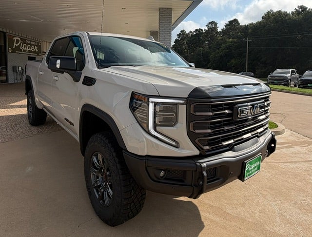 2026 GMC Sierra 1500 AT4X in Coastal Dune — front three-quarter view