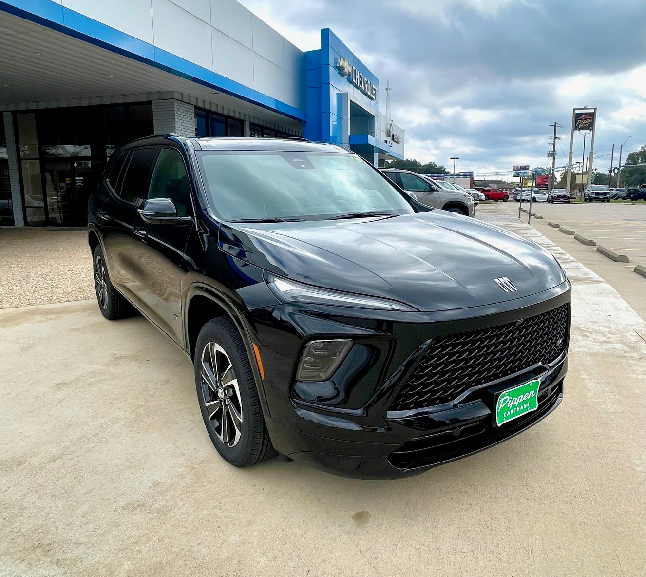 2026 Buick Enclave Sport Touring in Ebony Twilight Metallic — front three-quarter view